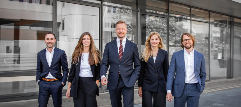 a group of people in suits